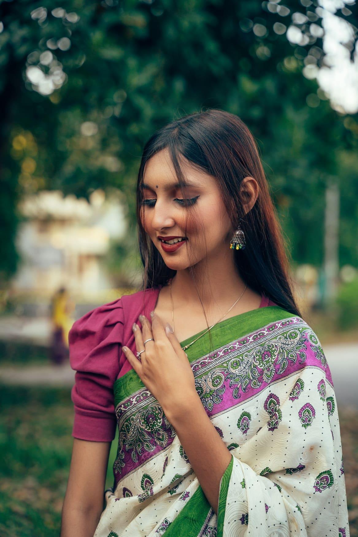 Woman wearing a magenta puff-sleeve blouse with a silk saree — view 2 of 2
