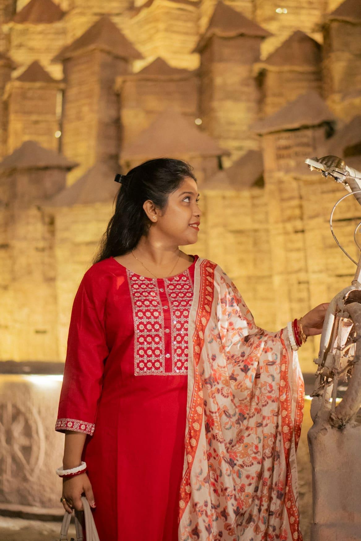 Woman in a red embroidered kurta with a printed dupatta — view 2 of 2