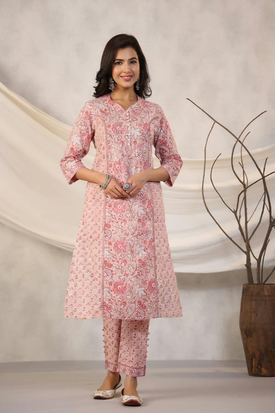 Woman in a rose pink block-printed kurta and pants